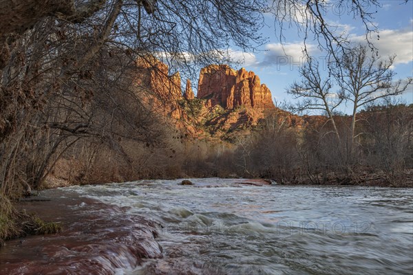 Cathedral Rock sandstone formations tower over Oak Creek at the Crescent Moon Picnic Site in