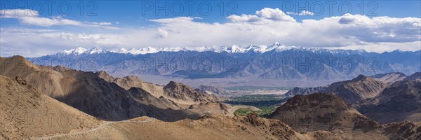 Panorama from the Khardong Pass, the second highest motorway pass in the world, over Leh and the