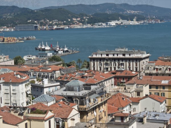 City view with red roofs, harbour, sea and surrounding hills on a clear day, Bari, Italy, Europe