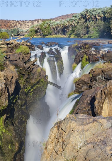 Epupa Falls waterfall on the Kunene River backlit, long exposure, Kunene, Namibia, Africa