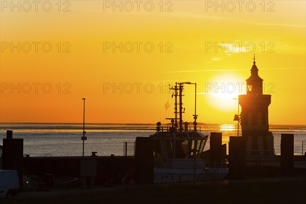Pingelturm, historic lighthouse in the harbour, atmospheric, golden, beautiful sunset, silhouette