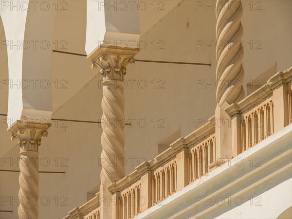 Beige columns and arches of a building with architectural details, Tunis in Africa with ruins from