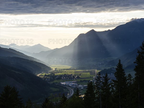 Sunlight falls on the Liesingtal valley and the village of Traboch, Schoberpass federal road, view