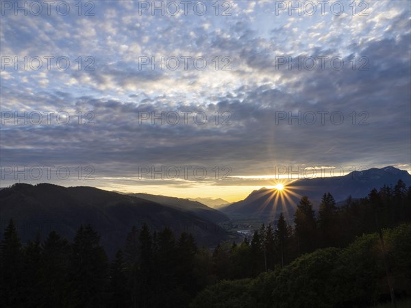 Cloudy mood, sunset over the Eisenerz Alps, mountain massif Reiting, in the Liesingtal the village