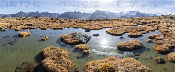 Small lake on the high plateau of the Gurgler Seenplatte, glaciated mountain peaks in the