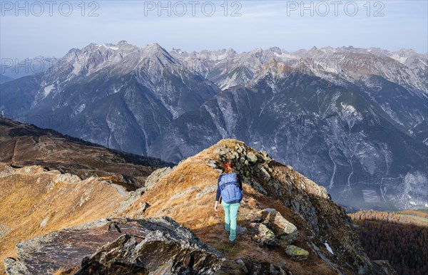 Mountaineer in the mountains in autumn, Venet crossing, Oetztal Alps, Tyrol, Austria, Europe