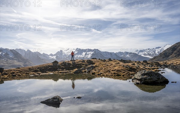 Mountaineers at a small lake on the high plateau of the Gurgler Seenplatte, glaciated mountain
