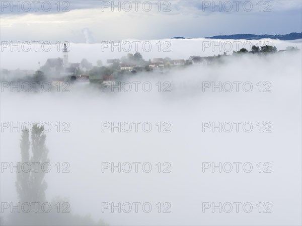 Church rises out of the morning mist, Frauenberg pilgrimage church, near Leibnitz, Styria, Austria,