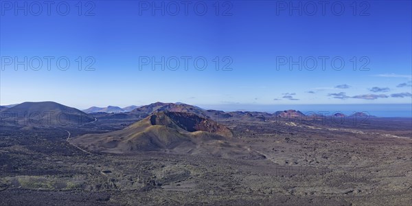 Panorama from the crater rim of Caldera Blanca to the fire mountains in the Parque National de