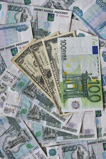 Background of paper bills dollars, euros and rubles. Currency exchange rate
