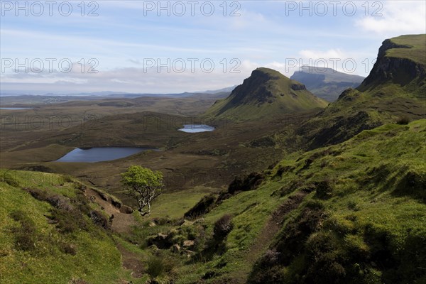 Quiraing, landscape in Scotland, mountainousWide mountain landscape with lakes and valleys under a