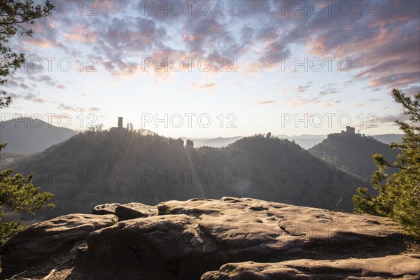 View of Trifels Castle, from Engels Landing rock, with the young tower in autumn at sunset.