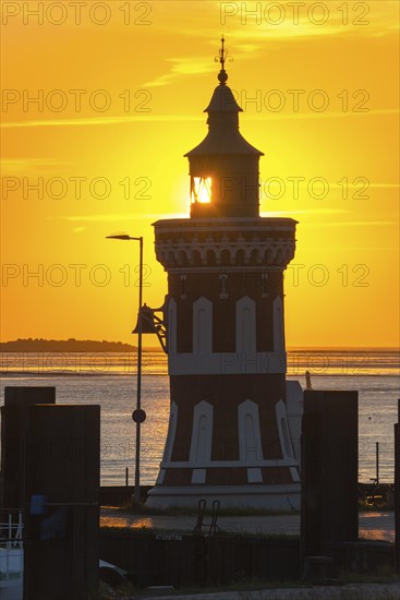 Pingelturm, historic lighthouse with bell in the harbour, close-up, atmospheric, golden, beautiful