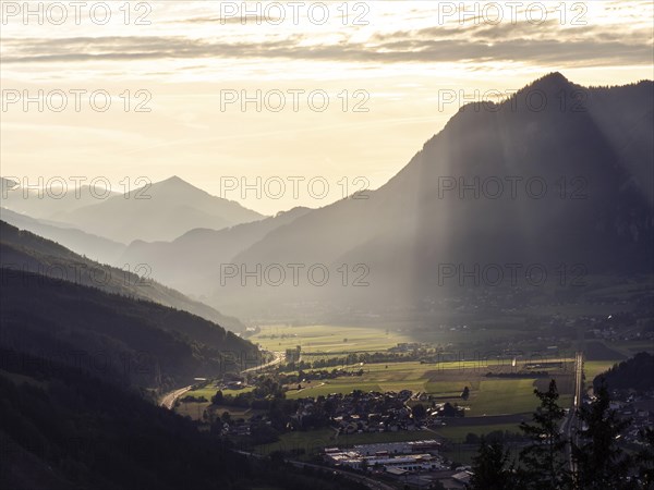 Sunlight falls on the Liesingtal valley and the village of Traboch, Schoberpass federal road, view