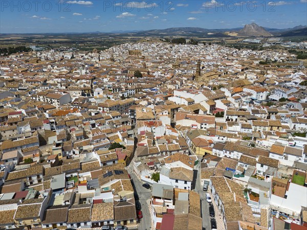 Aerial view of a picturesque spanish town with tightly packed rooftops and narrow streets