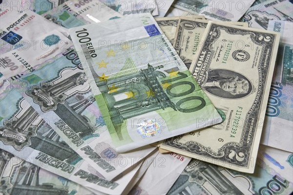 Background of paper bills dollars, euros and rubles. Currency exchange rate