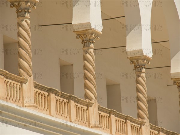 Close-up of architectural columns with ornate details in a light-coloured building, Tunis in Africa