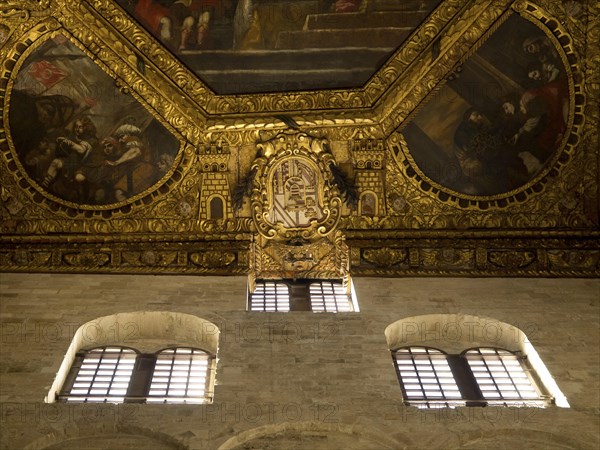 Richly decorated ceiling of a historic building with frescoes and gilded ornaments, The city of