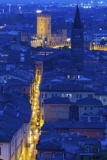 View of the illuminated Castelvecchio castle and the church of San Lorenzo, Verona, Veneto, Italy,