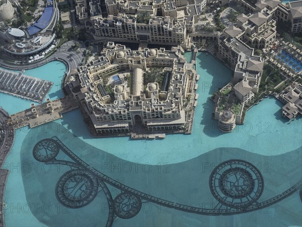 A luxurious hotel resort with large swimming pools and modern buildings, dubai, arab emirates