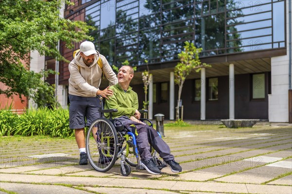 Full length photo of a caucasian adult man with special needs and friend walking along the