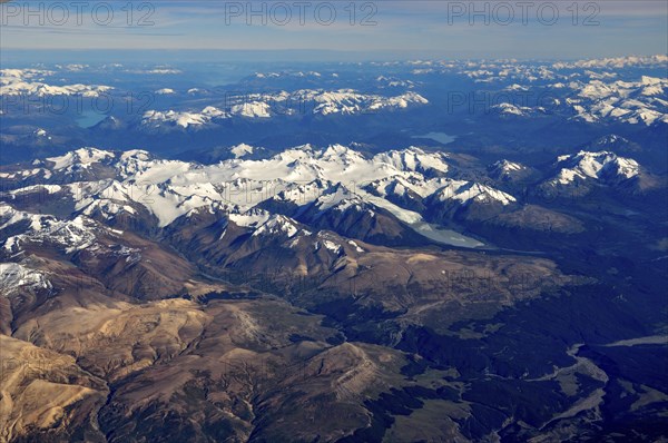 Aerial view of the snow-covered Patagonian Andes with the heavily glaciated Sierra La Sangra