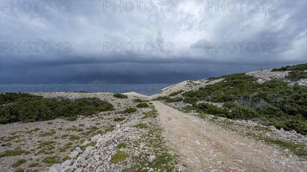 Stormy atmosphere and dark clouds on the coast, island of Pag, Zadar, Dalmatia, Croatia, Europe