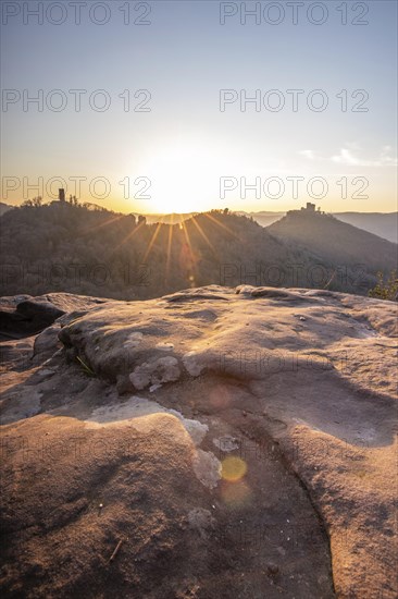 View of Trifels Castle, from Engels Landing rock, with the young tower in autumn at sunset.