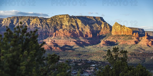 Evening sun lights up the red rock limestone formations surrounding Sedona, Arizona, United States