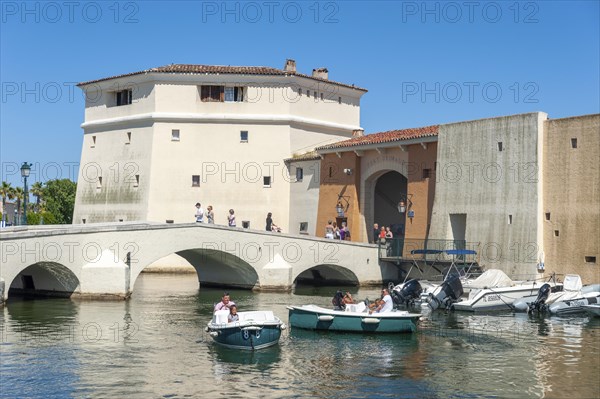 Bachelor tower, Tour des Celibataires, at the Pont de la Poteme bridge. In the foreground, tourists