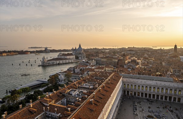 St Mark's Square and Basilica di Santa Maria della Salute on the Grand Canal at sunset, view from