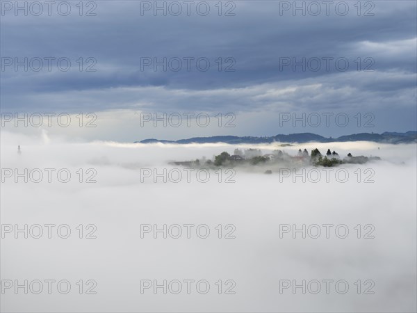 Morning fog over the village of Frauenberg, view from Silberberg, near Leibnitz, Styria, Austria,