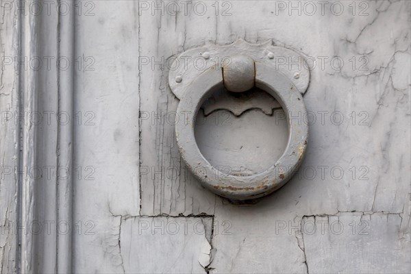 Door knocker on an old wooden door, Rome, Italy, Europe