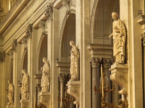 Detailed statues in a baroque church with golden elements and a sacred atmosphere, palermo in