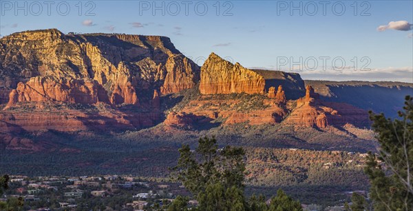 Evening sun lights up the red rock limestone formations surrounding Sedona, Arizona, USA, North