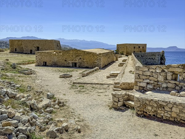 View of partly preserved old buildings on plateau of fortress, left rear former house of governor