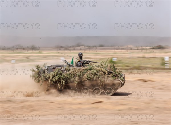 A German soldier on an M113 armoured transport vehicle, photographed during the NATO Steadfast