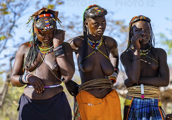 Hakaona woman with traditional kapapo hairstyle, Angolan tribe of the Hakaona, near Opuwo, Kunene,