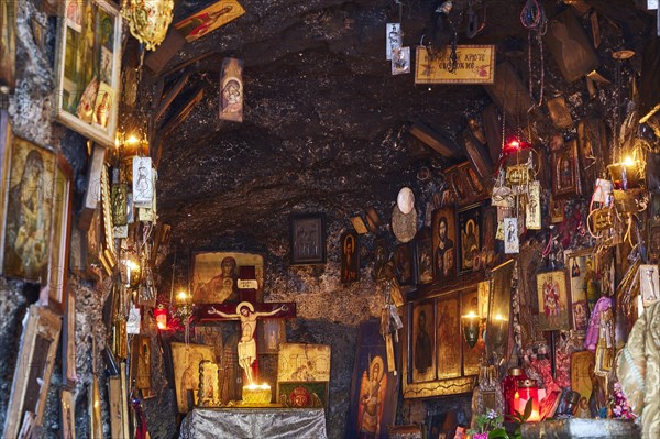 Rock Chapel, Archangel Michael Panormitits, Illuminated altar with a crucifix of Christ surrounded