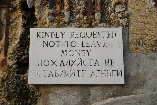 Rock Chapel, Archangel Michael Panormitits, A sign with the request not to leave money, in English