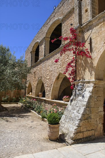 Interior of 1870 built building with arched openings to the courtyard on the site of the west gate