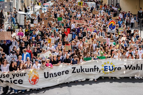 Demonstrators with signs at Fridays for Future, taken during the climate strike for the EU