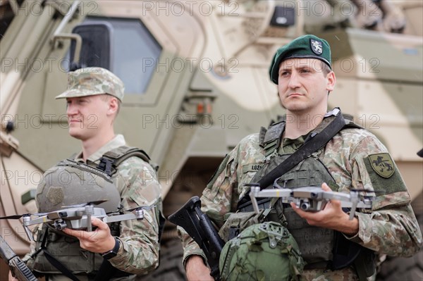 A Lithuanian army drone pilot holds a reconnaissance drone, taken during the NATO Steadfast