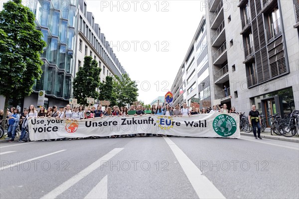 Demonstrators with signs at Fridays for Future, taken during the climate strike for the EU