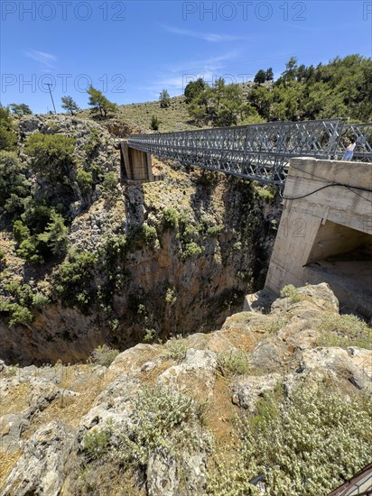 View from car park above Aradena gorge to steel girder bridge over gorge part of road from Anopolis