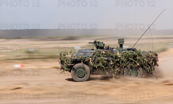 Dutch soldiers on a camouflaged Fennen trailer, during the NATO Steadfast Defender large-scale