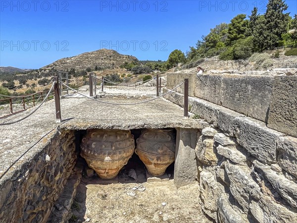 View into historical storeroom below present floor level with two large decorated clay vessels