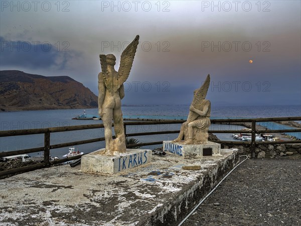 Photo taken at dusk evening mood of monument to Daedalus and Icarus on cliff of flight for flight