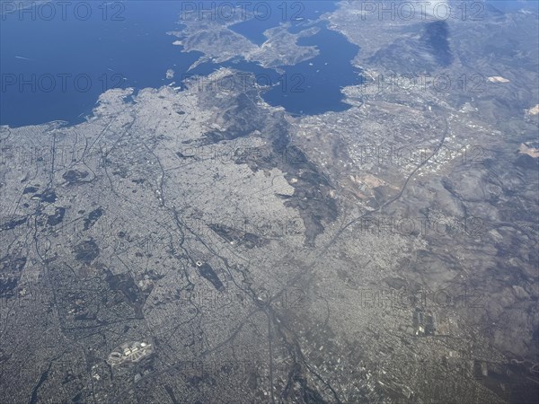 Aerial view from high altitude Overview of the city of Athens, bottom left in the picture Olympic