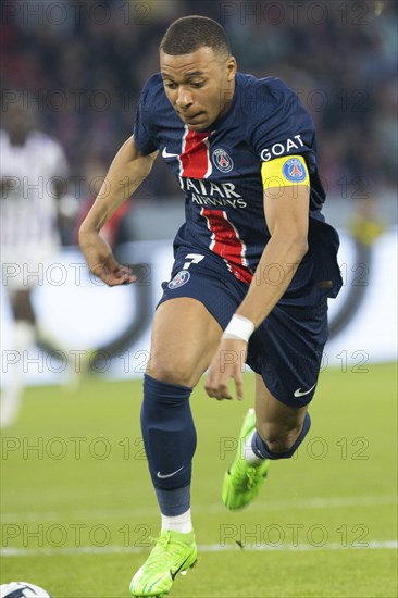 Football match, captain Kylian MBAPPE' Paris St Germain energetically running after and leading the